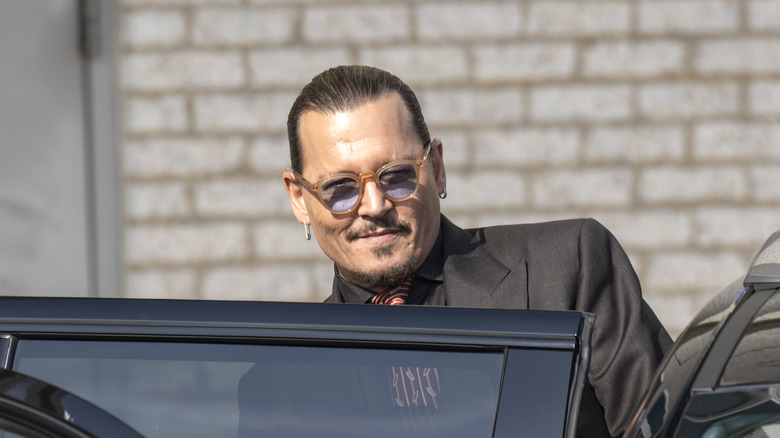 Johnny Depp gets into a car outside court