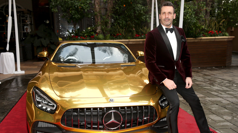 Jon Hamm leaning on Mercedes