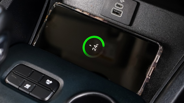 Phone charging in car charging pad