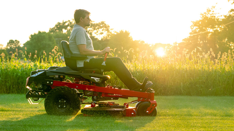 person riding gravely lawn mower
