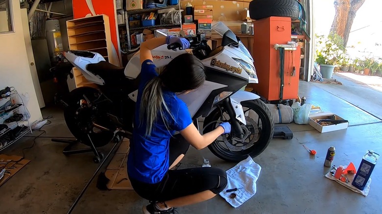 Woman Working On Kawasaki