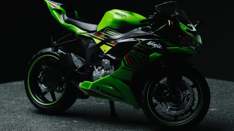 A miniature Kawasaki ZX-6R motorcycle in green with black trim