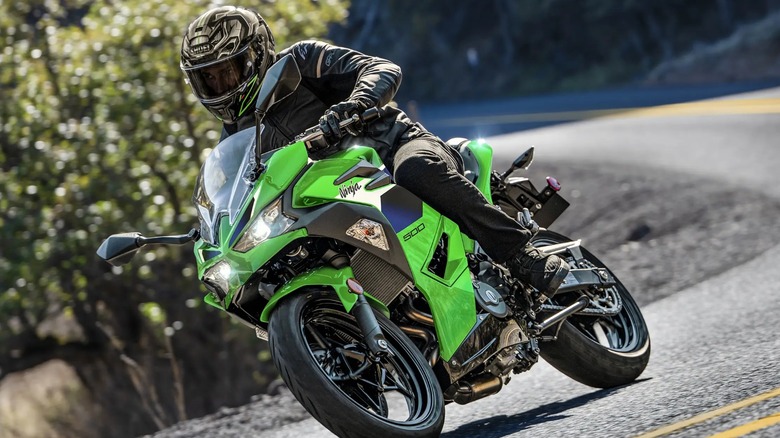 Rider taking a turn on a Ninja 500