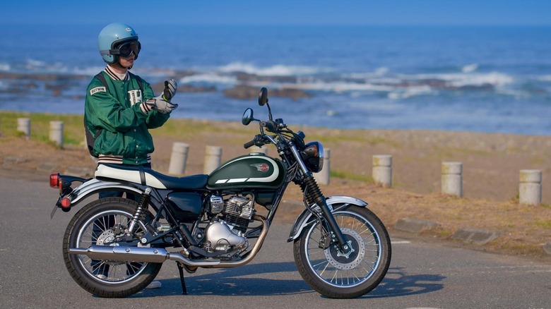 Person standing next to a Kawasaki W230