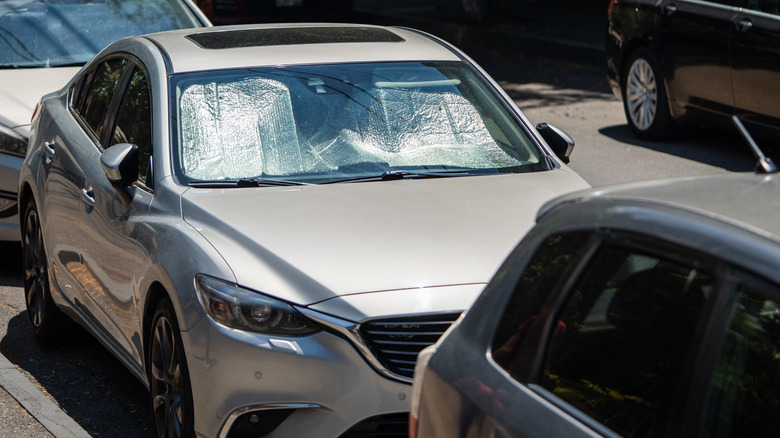car with windshield sunshade