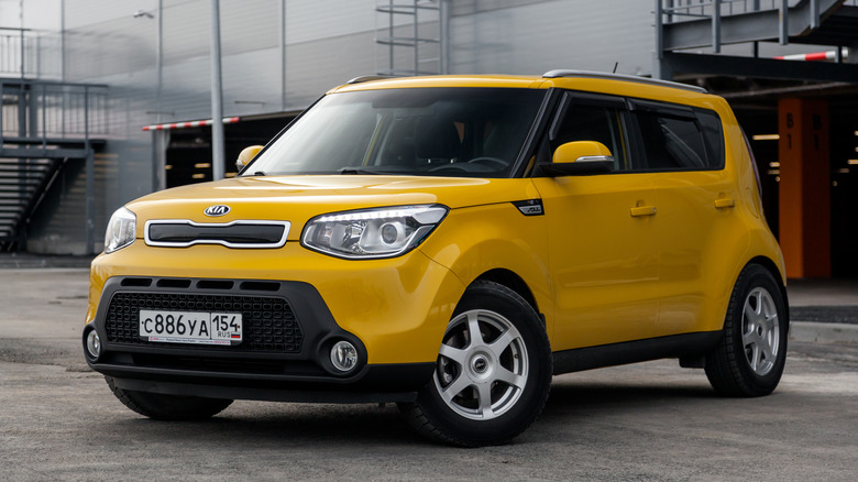 Yellow Kia Soul parked