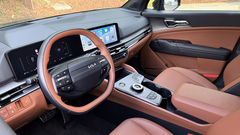 2026 Kia Sportage PHEV steering wheel and dashboard