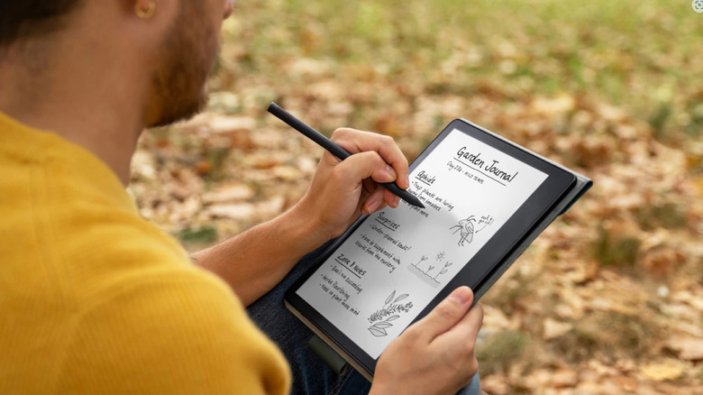 Man writing with Kindle Scribe