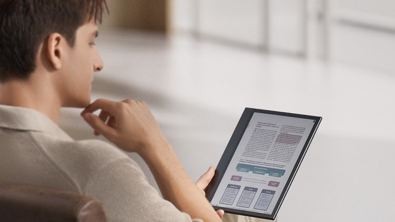 Person reading Onyx Boox tablet
