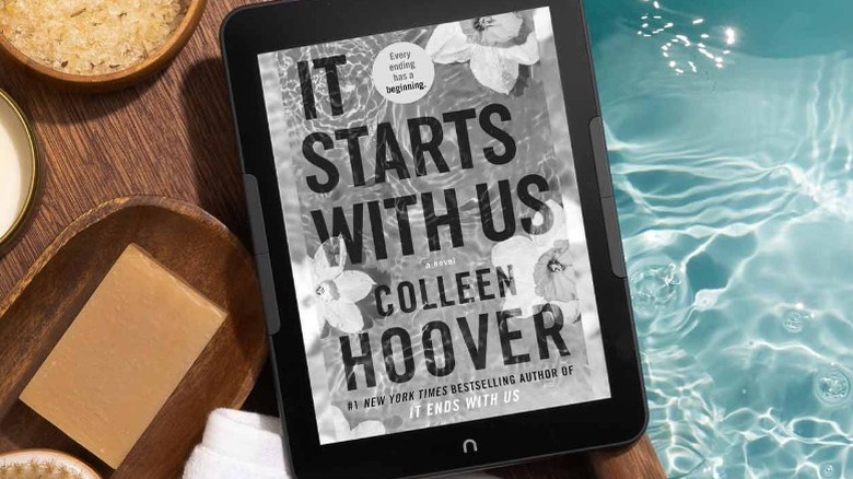Kindle GlowLight 4 Pro on the edge of a table over a pool