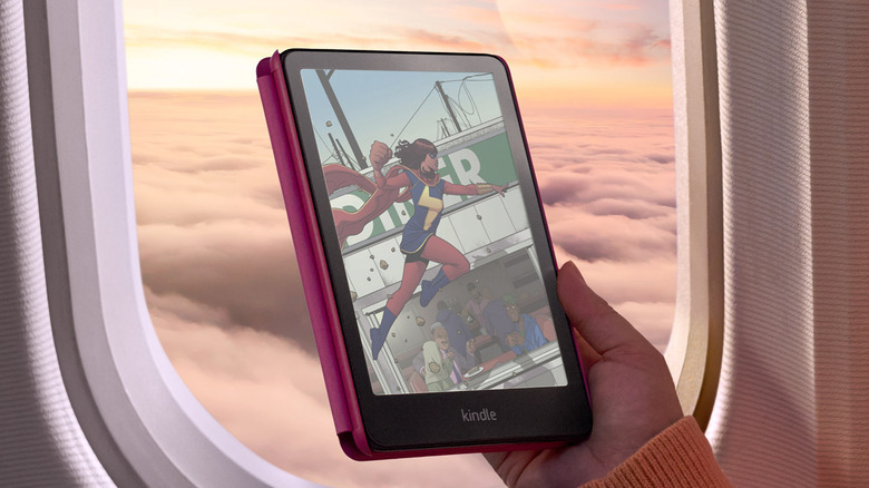 Person reading Kindle Colorsoft on plane