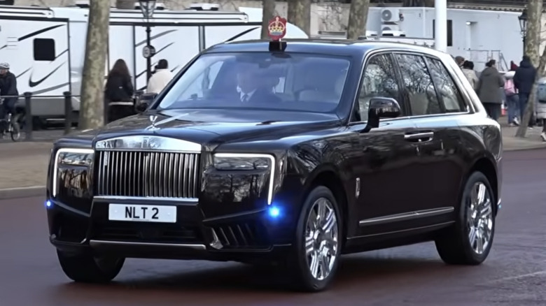 Front three-quarter view of King Charles' Rolls-Royce Cullinan II making its debut on the Mall