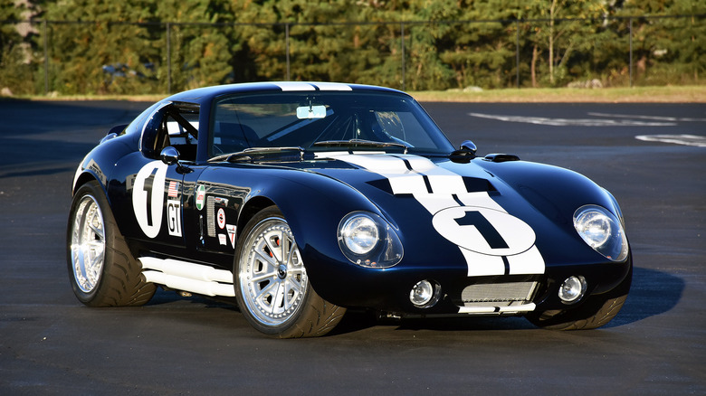 Factory Five Type 65 Coupe parked in a lot
