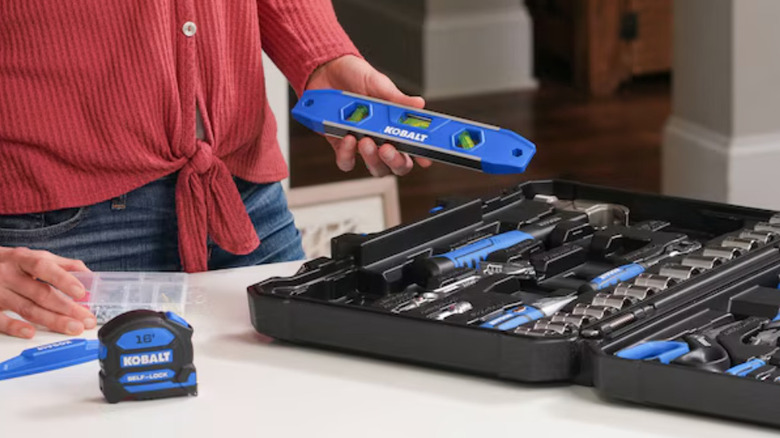 lady holding Kobalt leveller