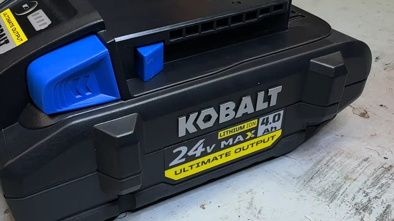 A Kobalt battery on a table.