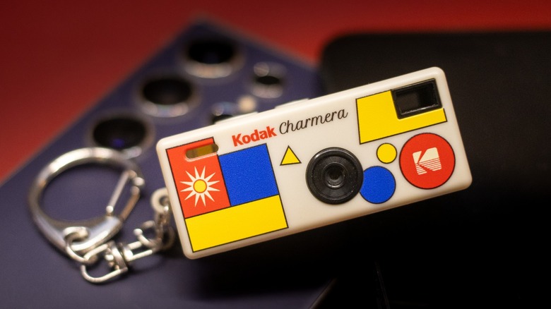 the Kodak Charmera on two smartphones