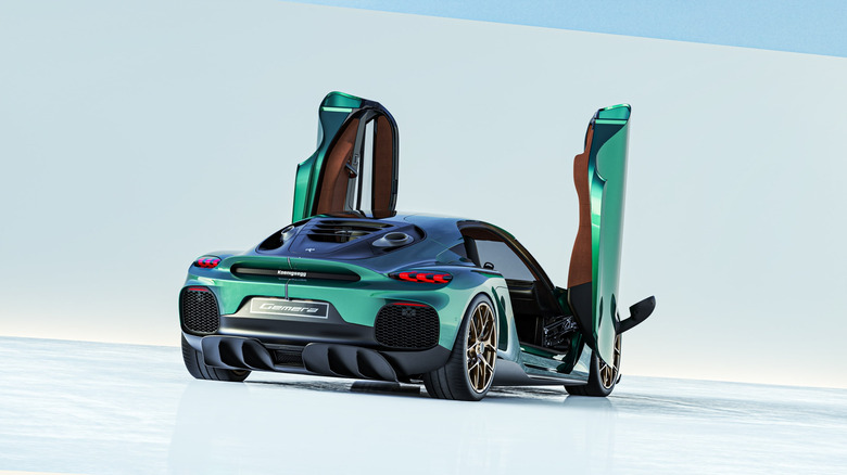 Rear 3/4 view of the Koenigsegg Gemera in green, doors up