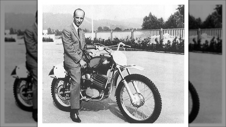 KTM Chief Erich Trunkenpolz sitting on top of KTM Penton
