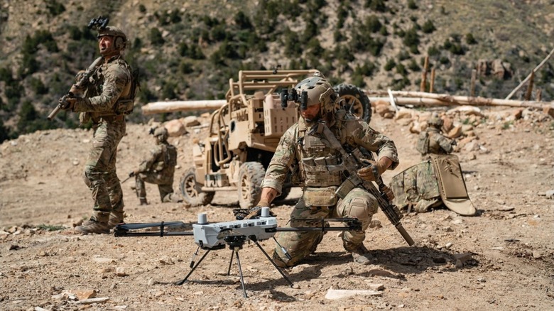 Soldiers setting up a C100 drone in the field