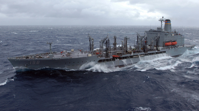 The replenishment oiler USNS Big Horn (T-AO 198) maneuvers in heavy seas during replenishment at sea operations.