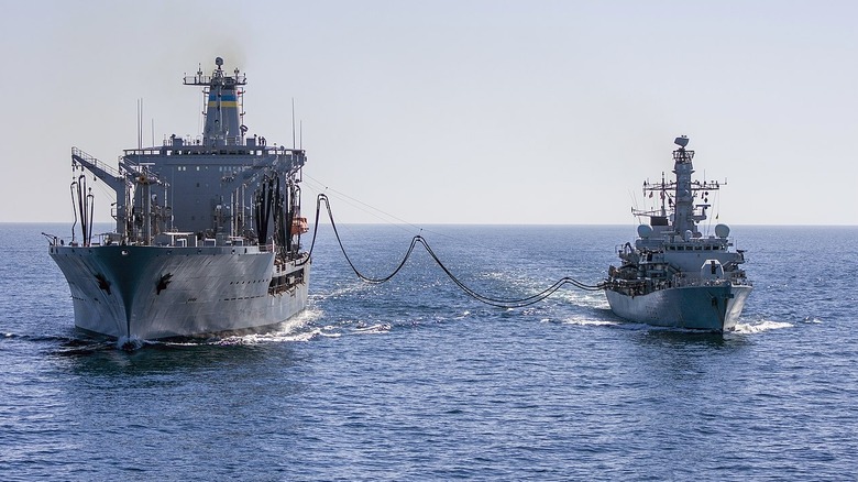 The HMS MONTROSE conducting a Replenishment at Sea (RAS) with USNS Big Horn.