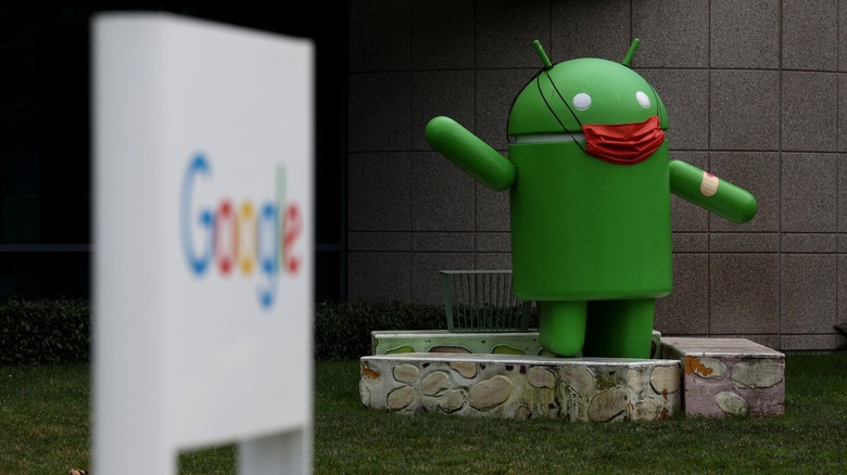 Android mascot near google sign