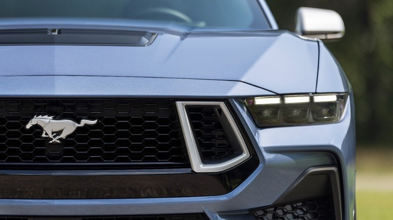 Close-up of the front of a silver-blue 2025 Ford Mustang
