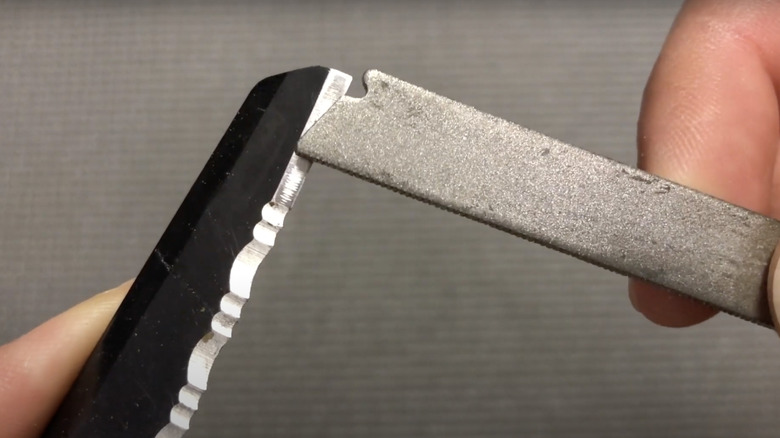 man holding multi tool and