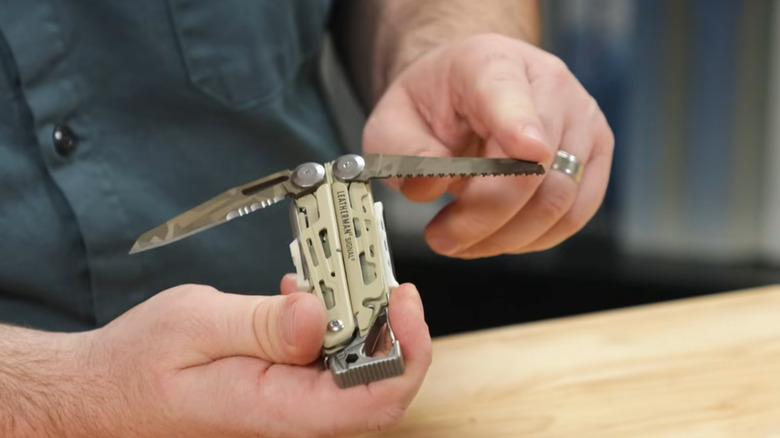 A man holding the new Leatherman Signal Sandstorm