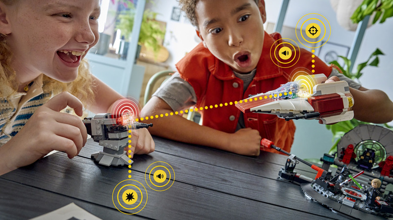 Children playing with LEGO Star Wars AI-powered smart brick tech toys