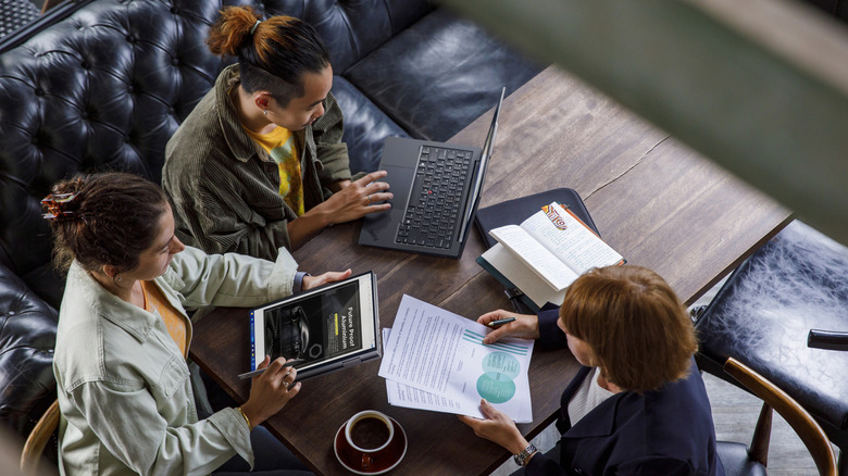 Lenovo users collaborate around coffee table