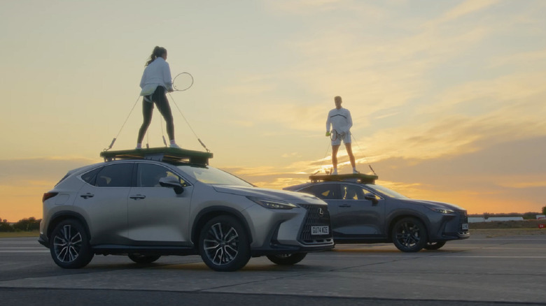 Laura Robinson and Jamie Murray playing a tennis rally at sunset on top of two moving Lexus NX Crossovers