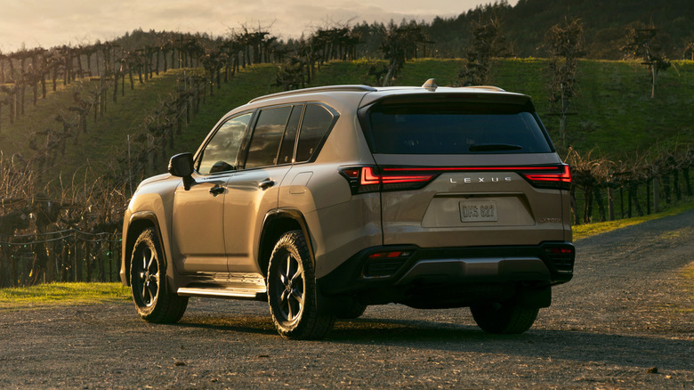 Silver Lexus LX700h parked on dirt