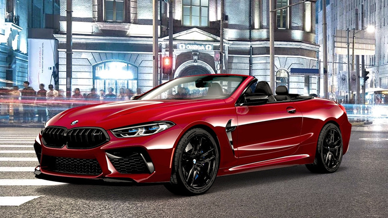 People looking at a BMW parked in the street