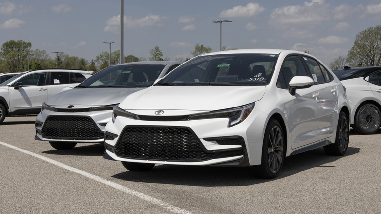 Two 2026 Toyota Corolla models side-by-side in a parking lot.