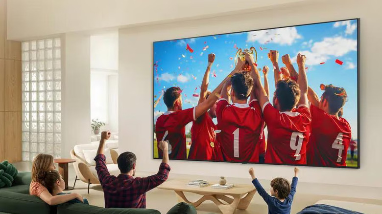 Family watching sports using an LG QNED92B TV