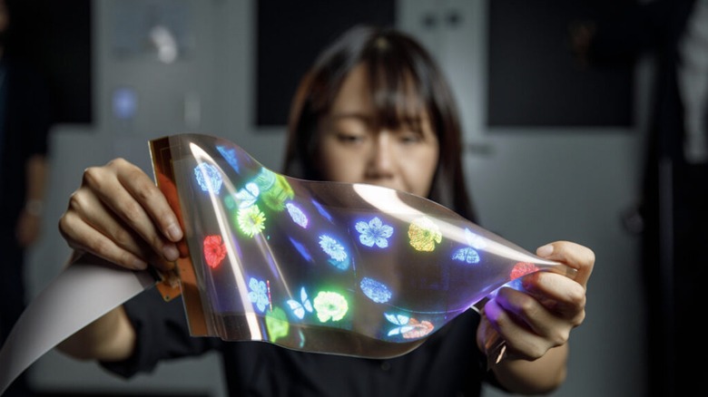 Woman holding LG's stretchable display
