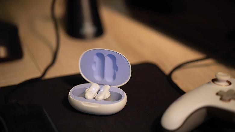 Logitech G Fits earbuds on gaming desk