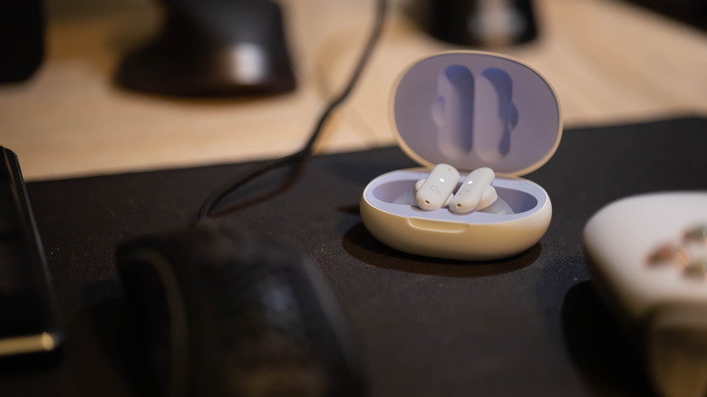 Logitech G Fits earbuds on gaming desk