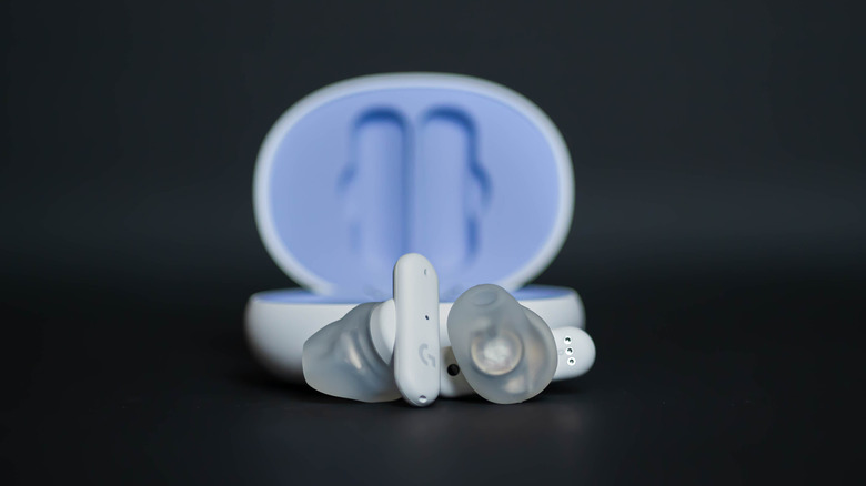 Logitech earbuds black background