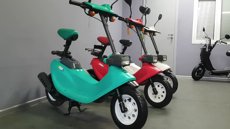 three Honda Zook scooters