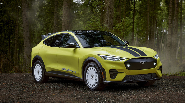A yellow Ford Mustang Mach-E Rally parked in the forest