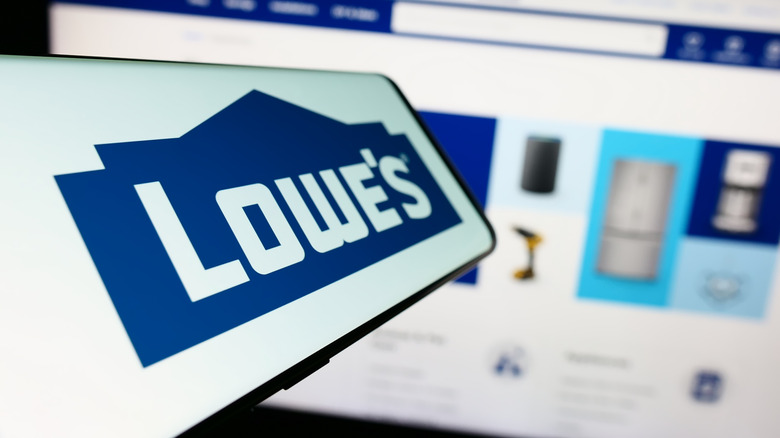 Lowe's logo on a screen in front of a website