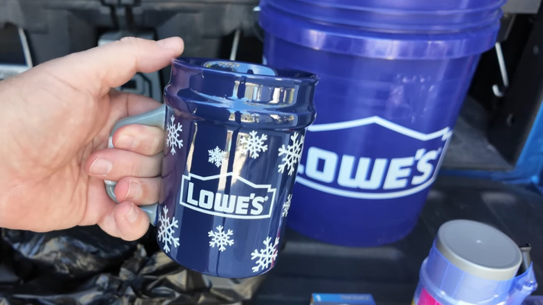 Lowe's bucket mug in man's hand