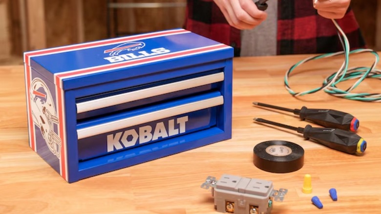 Person working on project using tools stored in a Kobalt NFL tool box