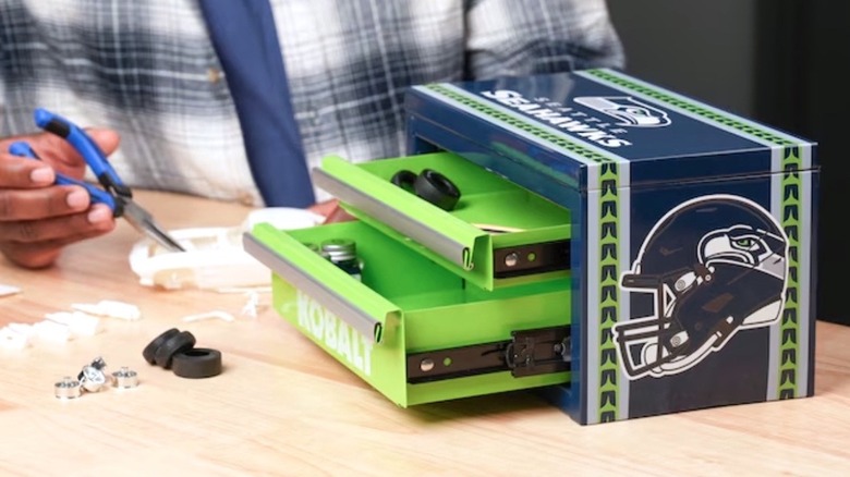 Person working on project using tools stored in a Kobalt NFL tool box