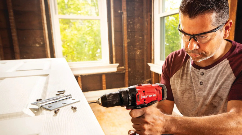 Craftsman V20 Max 1/2-inch Cordless Drill/Driver being used to build door