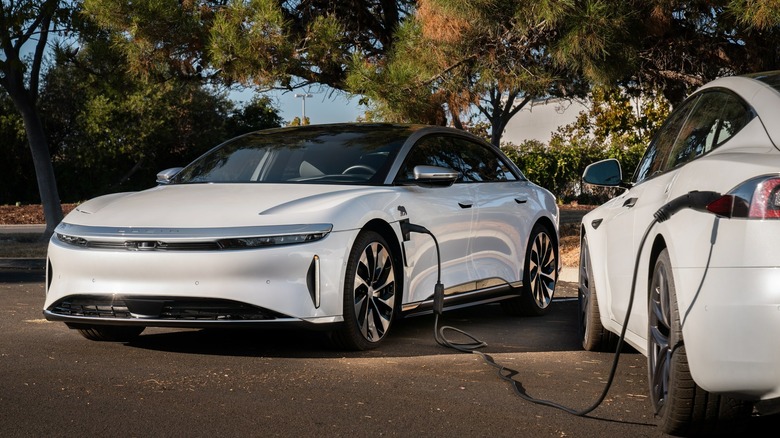 White Lucid Air charging another EV