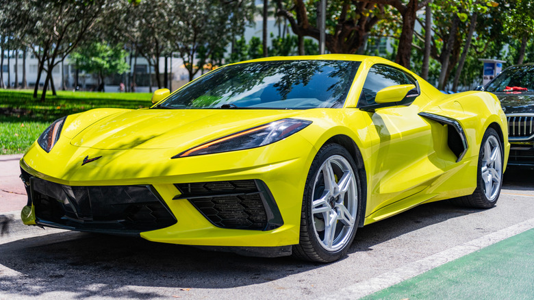 A green 2023 Chevrolet Corvette Stingray parked outside.