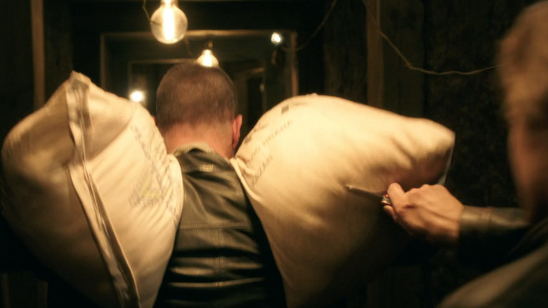 Mac cutting open bags of flour